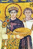 Justinian I (Latin: Flavius Petrus Sabbatius Iustinianus Augustus, Greek: Φλάβιος Πέτρος Σαββάτιος Ἰουστινιανός, c. 482 – 14 November 565), commonly known as Justinian the Great, was Byzantine Emperor from 527 to 565. During his reign, Justinian sought to revive the Empire's greatness and reconquer the lost western half of the classical Roman Empire.<br/><br/>

Tyrian purple (Greek, πορφύρα, porphyra, Latin: purpura), also known as royal purple, imperial purple or imperial dye, is a purple-red natural dye, which is a secretion produced by certain species of predatory sea snails in the family Muricidae, a type of rock snail by the name Murex. This dye was probably first used by the ancient Phoenicians. The dye was greatly prized in antiquity because the color did not easily fade, but instead became brighter with weathering and sunlight.<br/><br/>

Tyrian purple was expensive: the 4th-century-BC historian Theopompus reported, 'Purple for dyes fetched its weight in silver at Colophon' in Asia Minor. The expense meant that purple-dyed textiles became status symbols, and early sumptuary laws restricted their uses. The production of Tyrian purple was tightly controlled in Byzantium and was subsidized by the imperial court, which restricted its use for the colouring of imperial silks, so that a child born to a reigning emperor was styled 'porphyrogenitos' or 'born in the purple'.